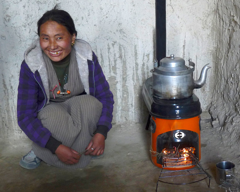 Fuel-efficient cookstoves bring bright smiles. | Credit- Himalayan Stove Project and Envirofit Stoves.