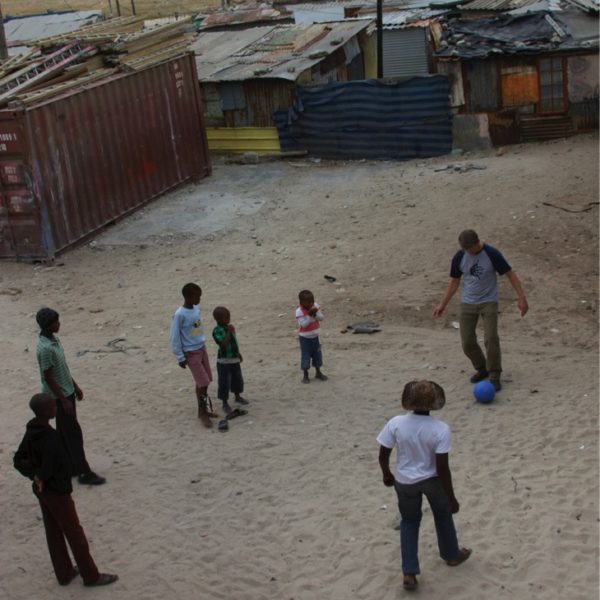 rocky rohwedder playing soccer with kids in South Africa